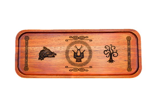 A rectangular wooden serving tray with a warm reddish-brown finish, featuring dark engraved symbols: a boar's head on the left, Cernunnos medallion, tree of life on the right, flanked by knotted pillar borders.