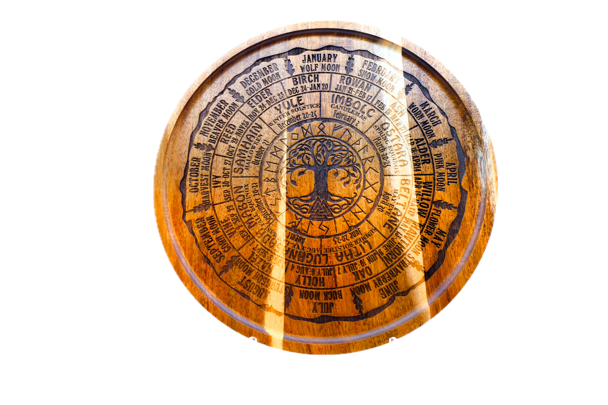A round acacia tray engraved with all eight Sabbats, the Celtic tree calendar, and the year's named moons around a central Tree of Life.